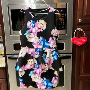Woman’s sleeveless peplum dress